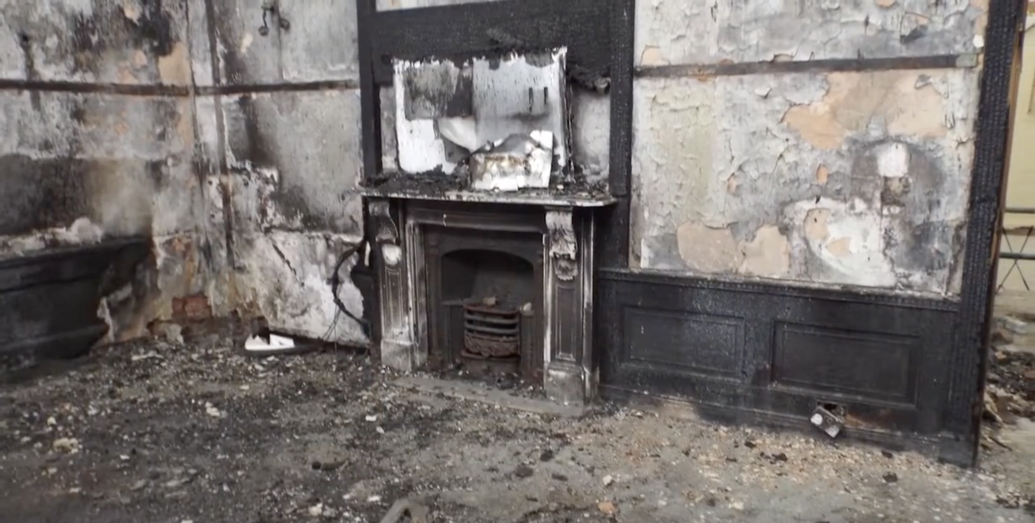 Coton House fire-damaged fireplace before restoration